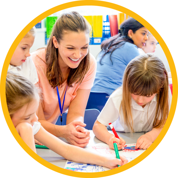 Teacher observes children drawing