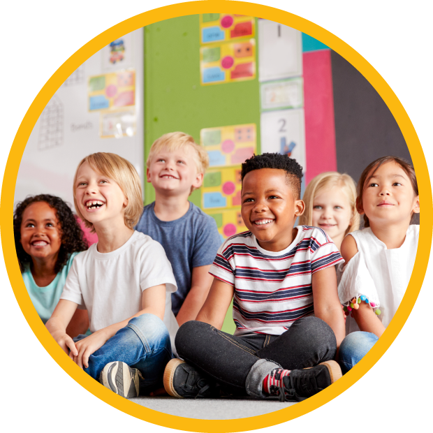 Children sit on floor listening